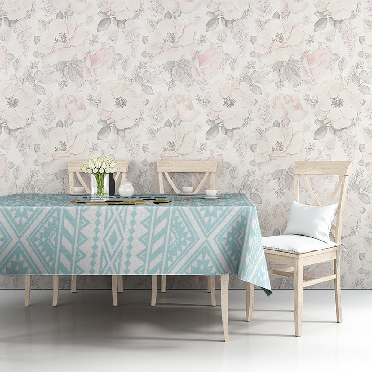 Mint geometric tablecloth on a dining table with white chairs