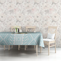 Mint geometric tablecloth on a dining table with white chairs