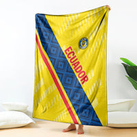 Football blanket held up, yellow with blue panel and red diagonal 'ECUADOR' stripe