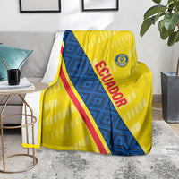 Football blanket on floor, yellow and blue diagonal design with red 'ECUADOR' lettering