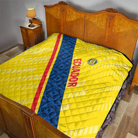 Yellow Ecuador football quilt on bed, blue diagonal stripe with red edge, quilted design