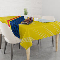 Yellow football tablecloth with blue-and-red diagonal stripe over dining table