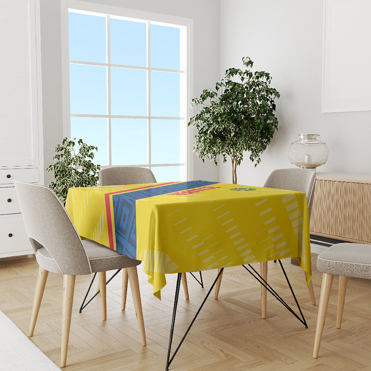 Yellow football tablecloth with blue-and-red diagonal stripe over dining set
