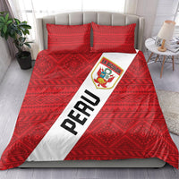 Red Peru football bedding set with La Bicolor crest and diagonal PERU stripe over geometric pillows.
