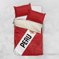 Red Peru bedding set with geometric pattern, La Bicolor crest, diagonal PERU stripe.