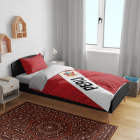 Red Peru football bedding set with diagonal PERU stripe, La Bicolor crest, and patterned duvet.
