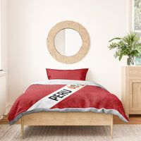 Red Peru bedding set with geometric pattern, diagonal PERU stripe, La Bicolor crest, pillowcases.