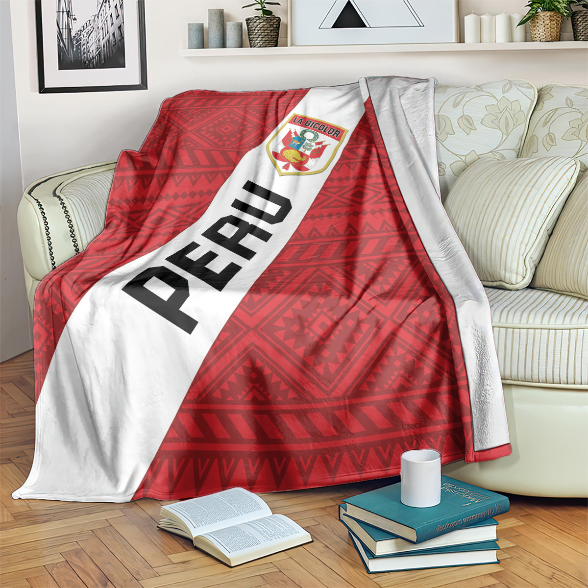Red football blanket with white diagonal stripe, PERU text and La Bicolor crest