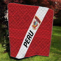 Red Peru football quilt blanket with quilted diamond pattern, diagonal white sash, and crest