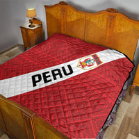 Red Peru football quilt blanket on bed with white diagonal sash, crest logo, and PERU lettering