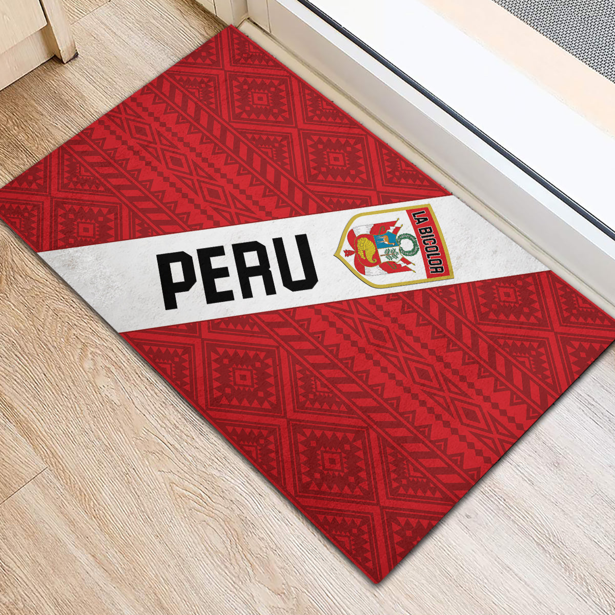 Red Peru football rubber doormat, white center stripe with PERU lettering and La Bicolor crest