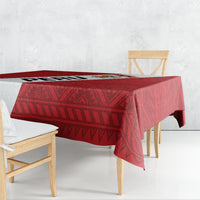 Red football tablecloth with repeating diamond and zigzag pattern over rectangular table