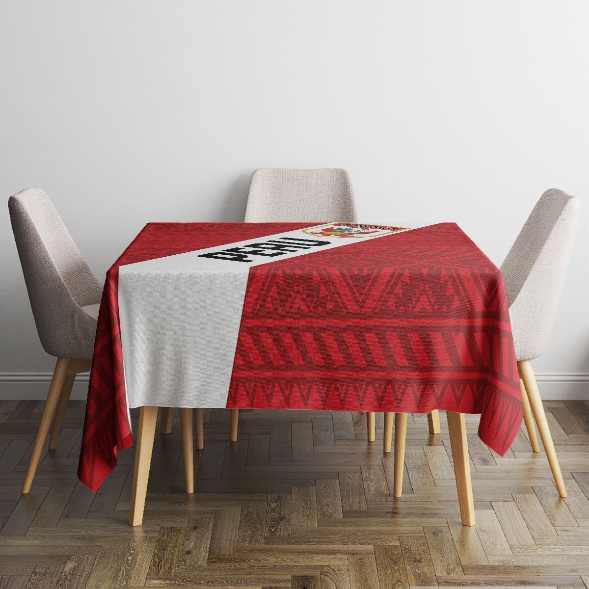 Red football tablecloth with geometric border pattern on small dining table