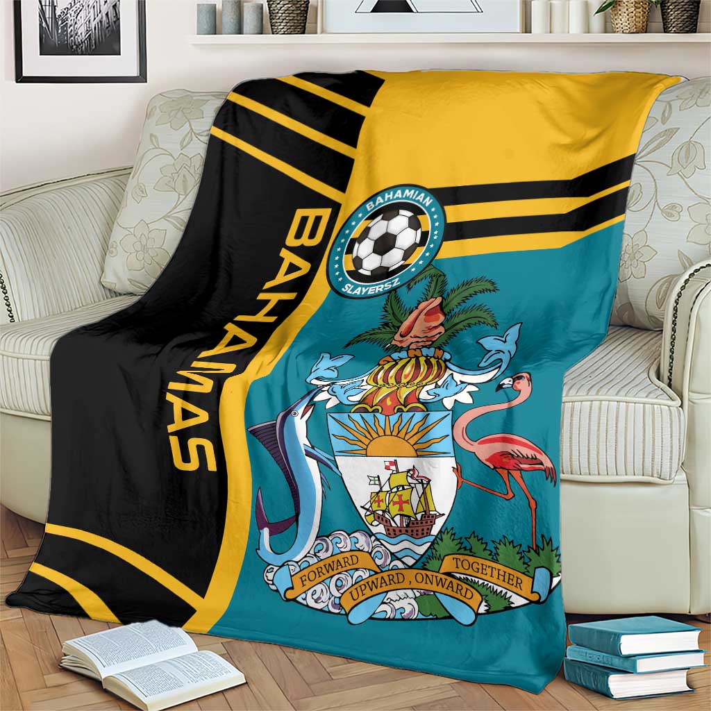 Football blanket draped on sofa: teal center with black and yellow stripes and team emblem