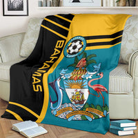 Football blanket draped on sofa: teal center with black and yellow stripes and team emblem