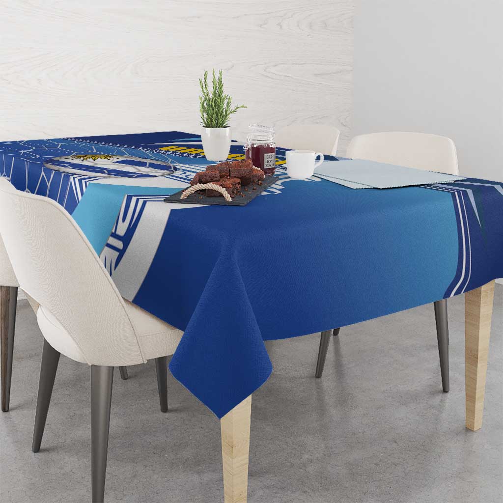 Blue football tablecloth with Uruguay-themed stripes pattern over a round table