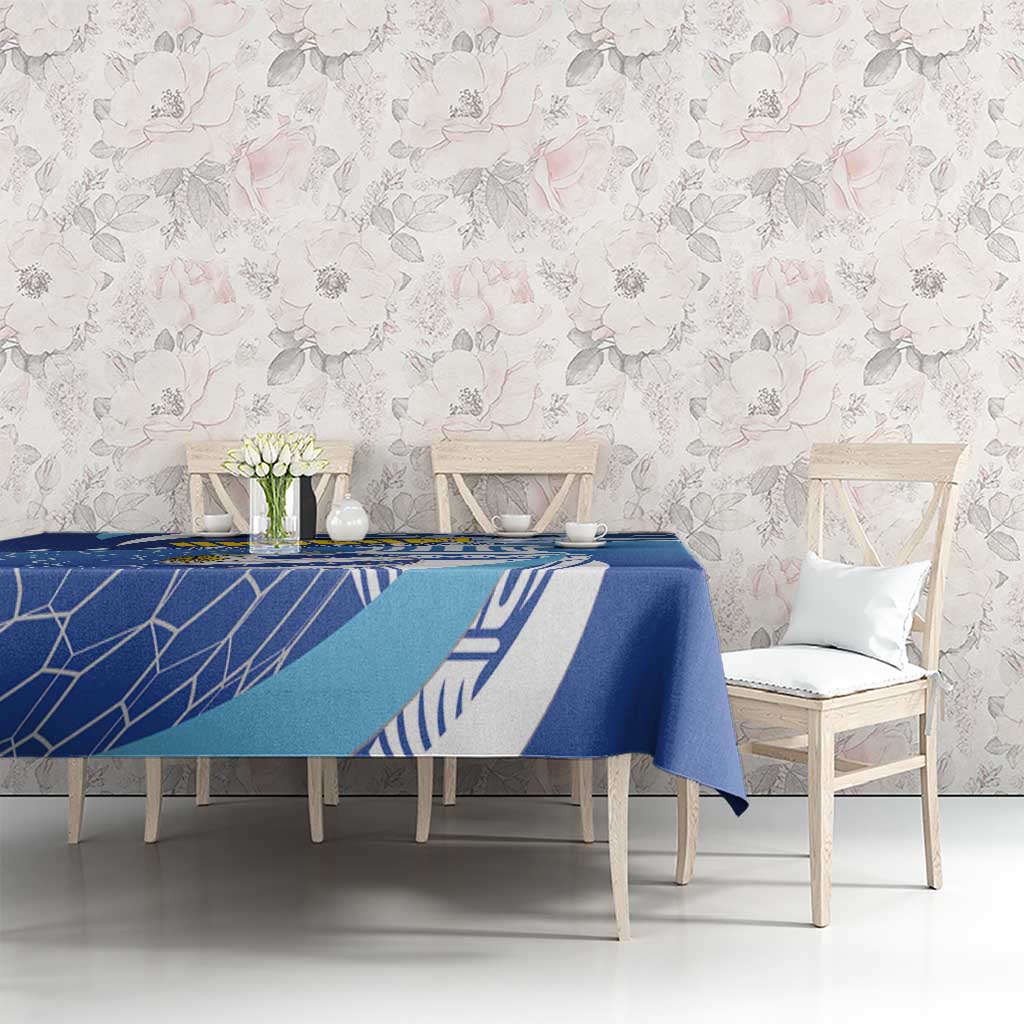 Blue football tablecloth with white geometric net lines and Uruguay emblem on dining set