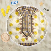 Round beach blanket with fringed edge, cream base, yellow flowers, blue geometric center