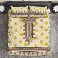 Yellow floral and geometric patterned bedding set with two matching pillowcases.