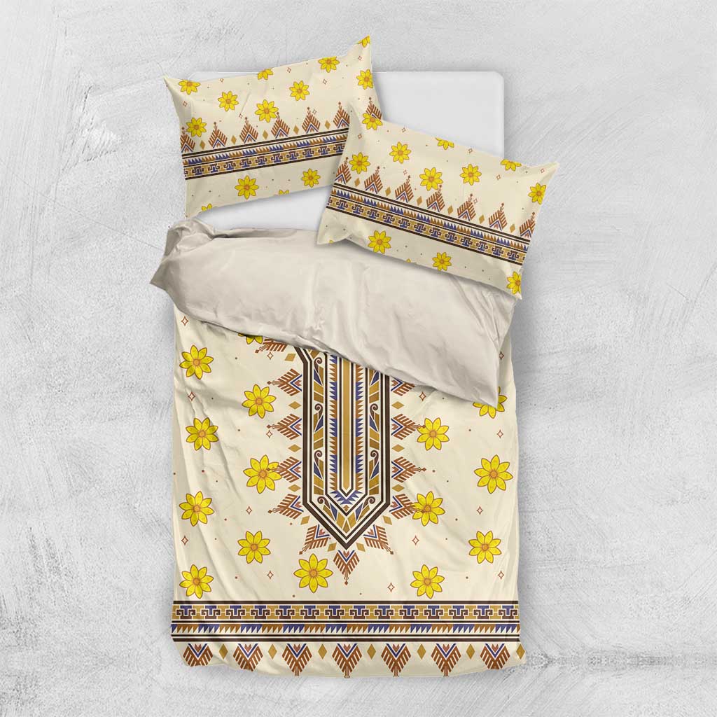 Yellow floral geometric bedding set with duvet and two pillowcases on a light background.