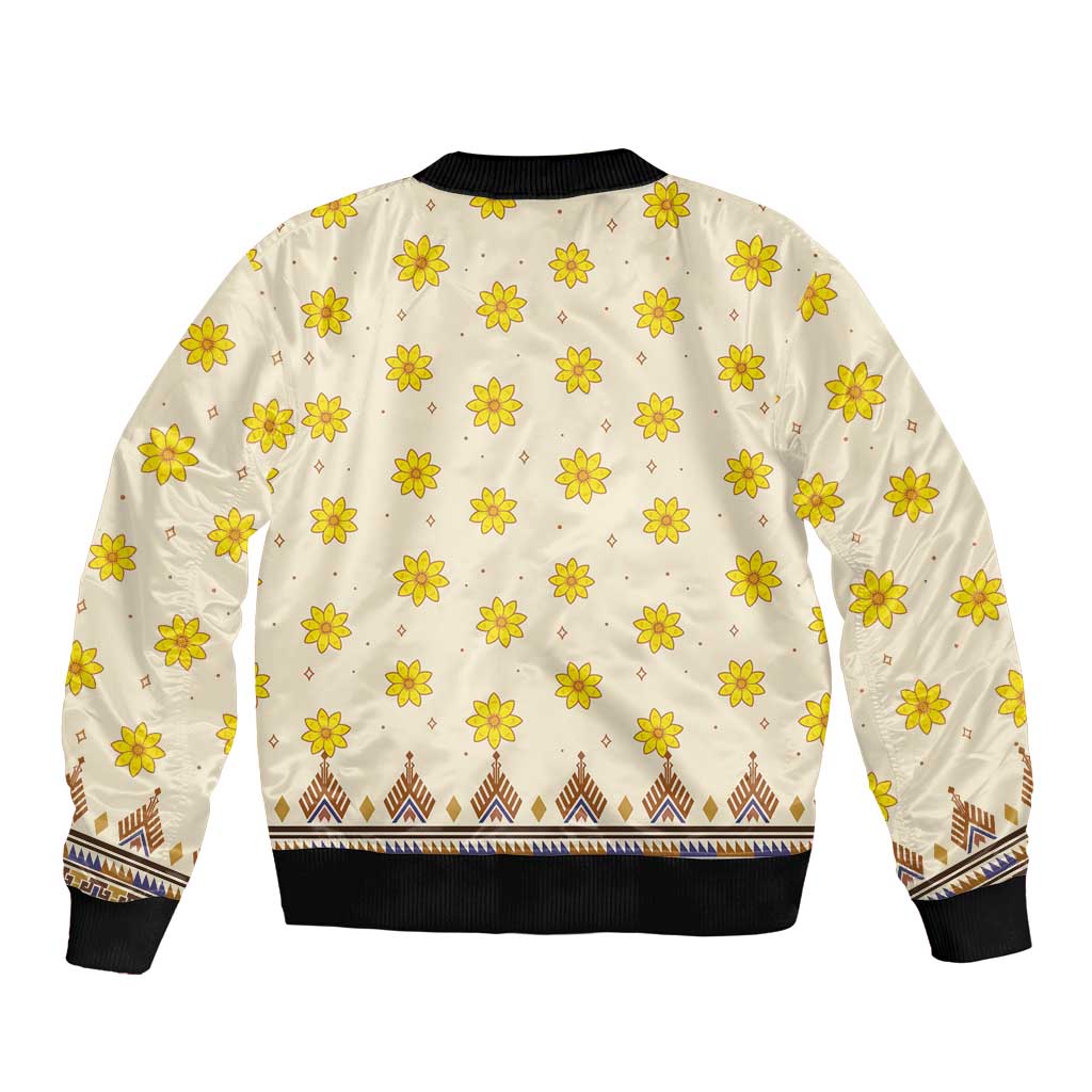 Unisex bomber jacket back with cream base and repeating yellow flower print, ribbed hem and cuffs