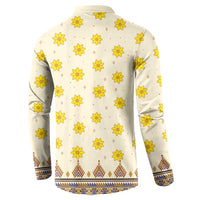 Back of long-sleeve dashiki sweatshirt, off-white with yellow flower pattern and blue hem trim