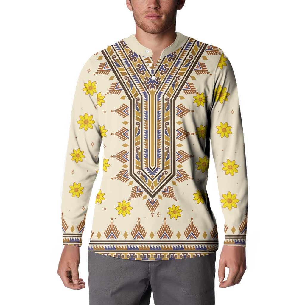 Long-sleeve dashiki sweatshirt on model, off-white with yellow flowers and blue-brown neckline trim