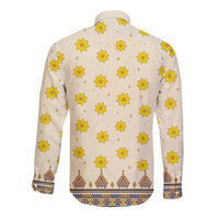Cream long-sleeve dashiki back with scattered yellow flowers and blue geometric border hem