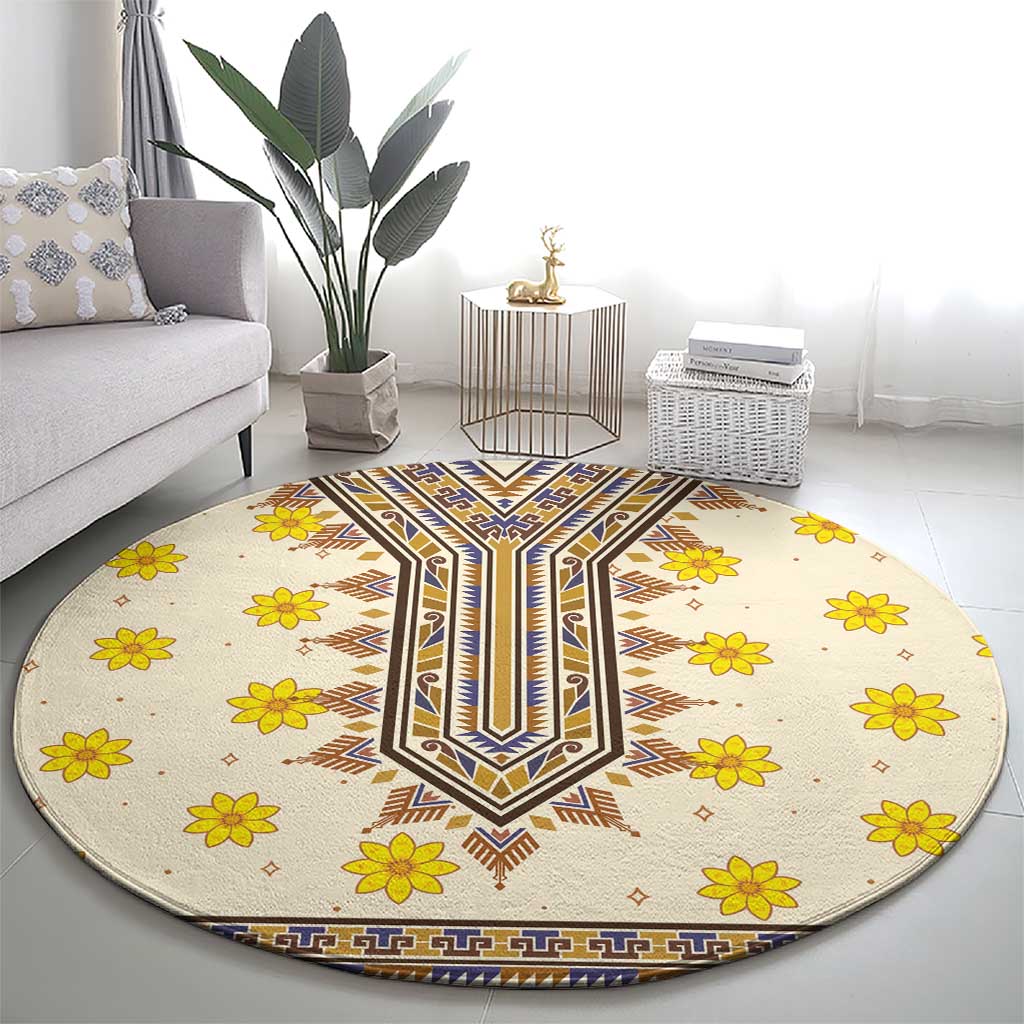 Round beige carpet with blue and brown geometric centerpiece and yellow flowers