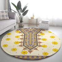 Round beige carpet with blue and brown geometric centerpiece and yellow flowers