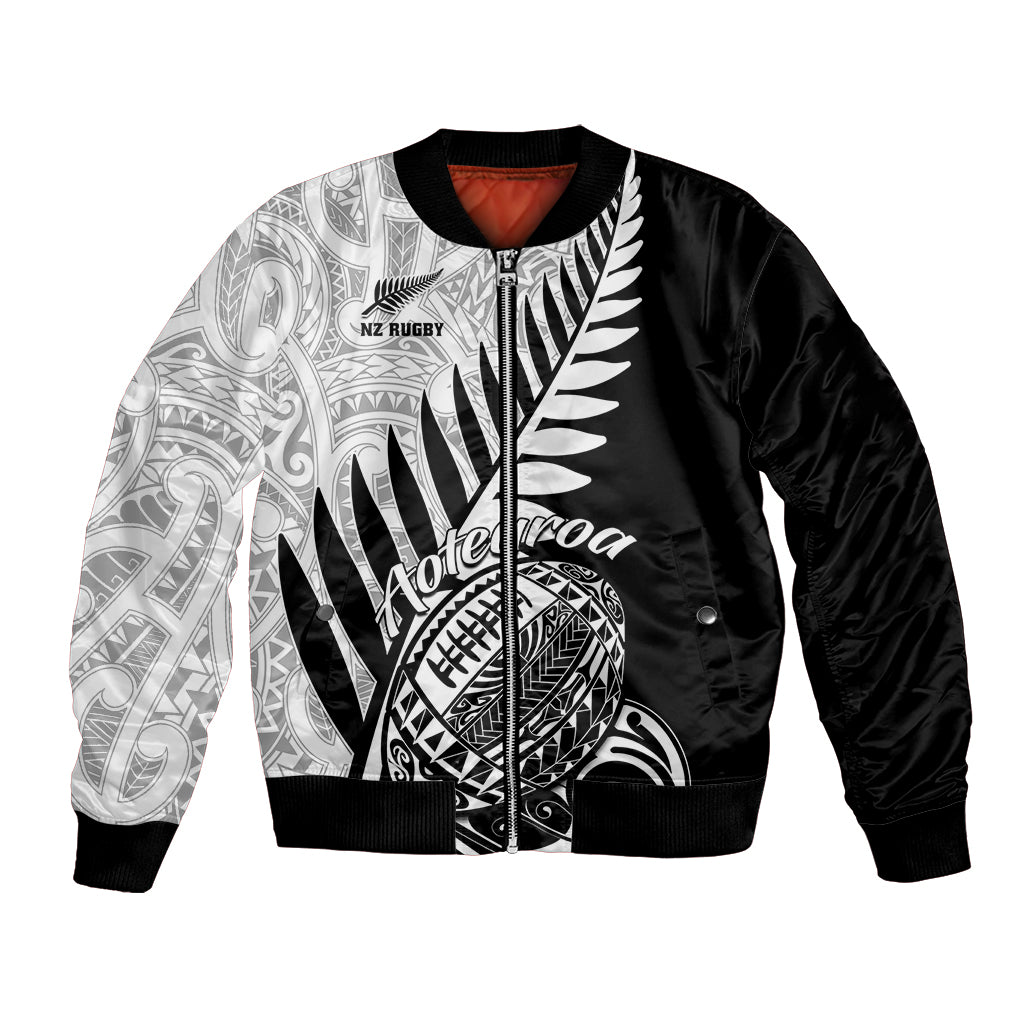 Black bomber jacket with white Maori tribal print and zip front, ribbed cuffs and hem