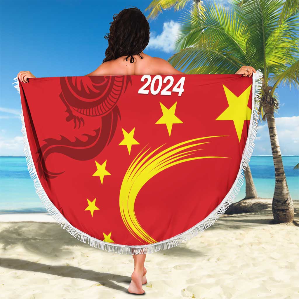 Round red beach blanket with fringe, held up with China 2024 dragon and yellow stars