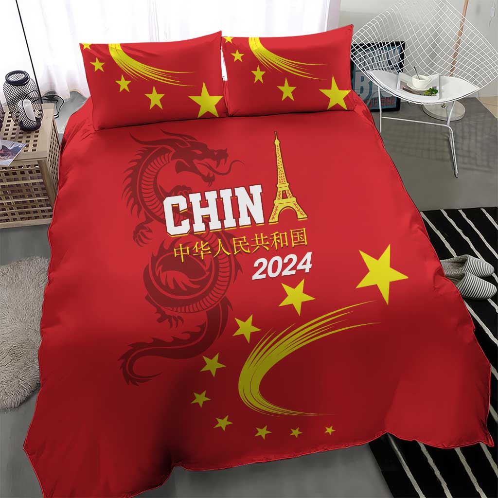 Red duvet and pillowcases featuring China 2024 text, yellow stars, and dragon