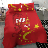 Red duvet and pillowcases featuring China 2024 text, yellow stars, and dragon