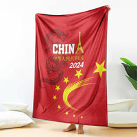 Red China 2024 blanket with dragon motif, CHINA lettering, yellow stars and crescent arc