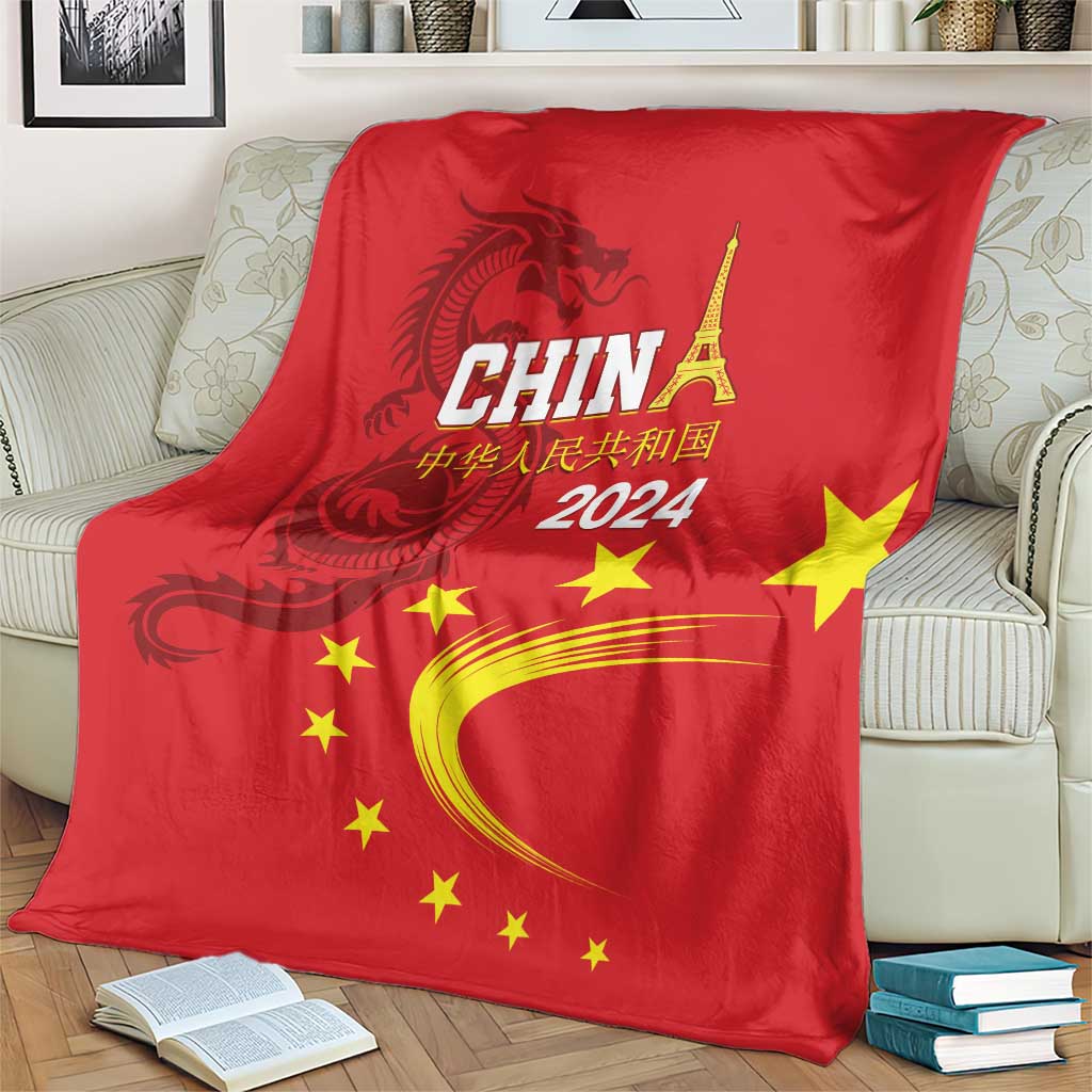 Red China 2024 blanket with dragon and CHINA lettering, yellow stars and curved arc