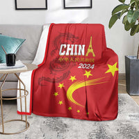 Red China 2024 blanket with CHINA text, dragon design, yellow stars and yellow arc