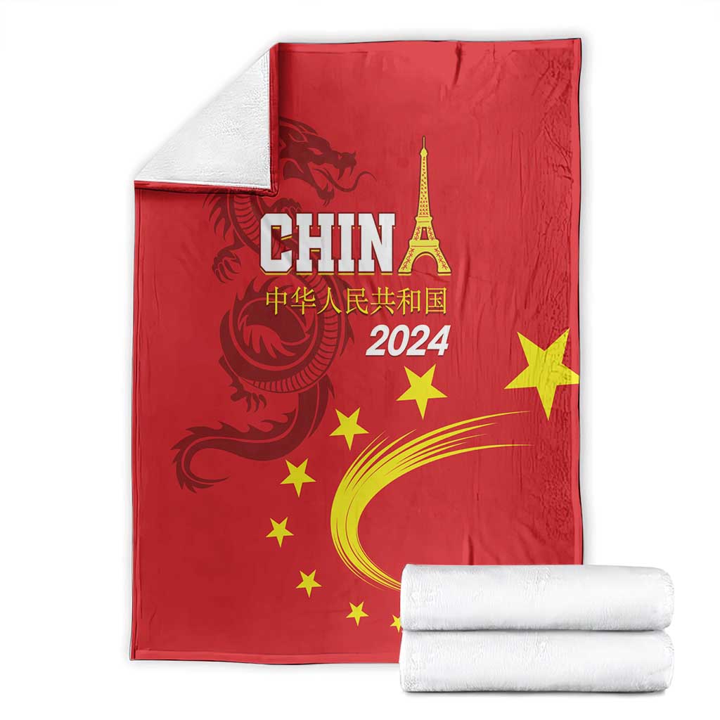 Red China 2024 blanket folded with CHINA text, dragon emblem and yellow stars