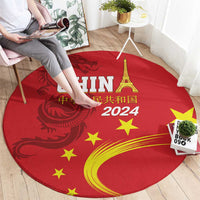 Round red rug with gold dragon, stars, Eiffel Tower, and CHIN 2024 lettering