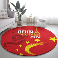 Round red carpet rug with gold dragon, stars, Eiffel Tower, and “2024”