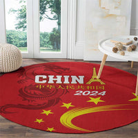 Round red rug with gold dragon, stars, Eiffel Tower, and 2024 lettering