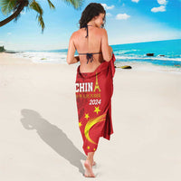 Red sarong wrap with ties; CHINA 2024 emblem and yellow star accents on back