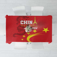 Red tablecloth with bold “CHINA 2024” text and gold dragon plus star graphics