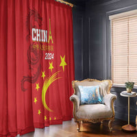 Red curtain panel with dragon emblem, CHINA 2024 lettering, and yellow stars