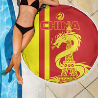 Fringed round beach blanket on poolside: 'CHINA' with red/yellow flag, dragon and Eiffel