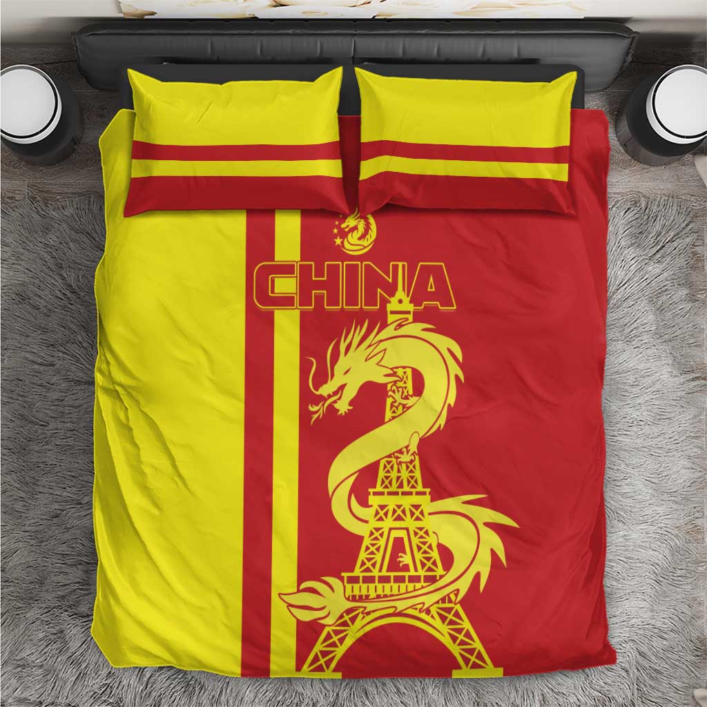 Red and yellow bedding set with CHINA lettering, dragon, and Eiffel Tower on duvet