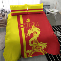 Red and yellow duvet set with two pillows featuring CHINA, dragon, and Eiffel Tower design