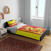 Red and yellow bedding set on bed with CHINA dragon and Eiffel Tower print