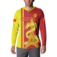 Red/yellow long-sleeve button polo with China graphic and dragon beside Eiffel Tower