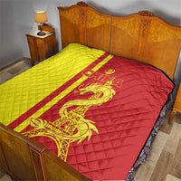 Quilted red and yellow China-themed bed throw with dragon and Eiffel Tower graphic